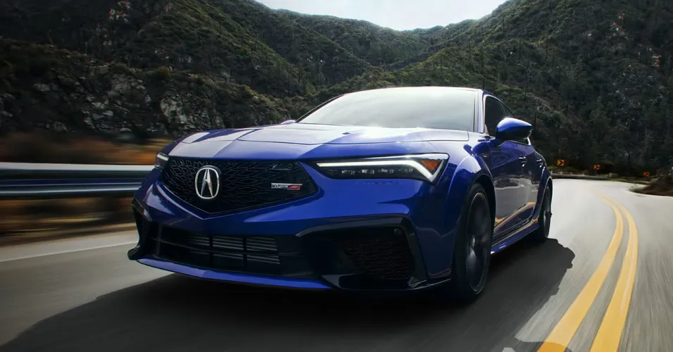 Blue Luxury Car With Mountains Behind It